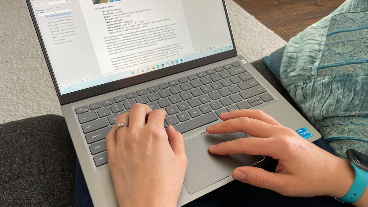 Typing a document on a laptop